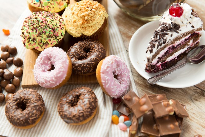 dreamstime_xxl_55594109 Eat what you want day food donuts candy black forest cake and more